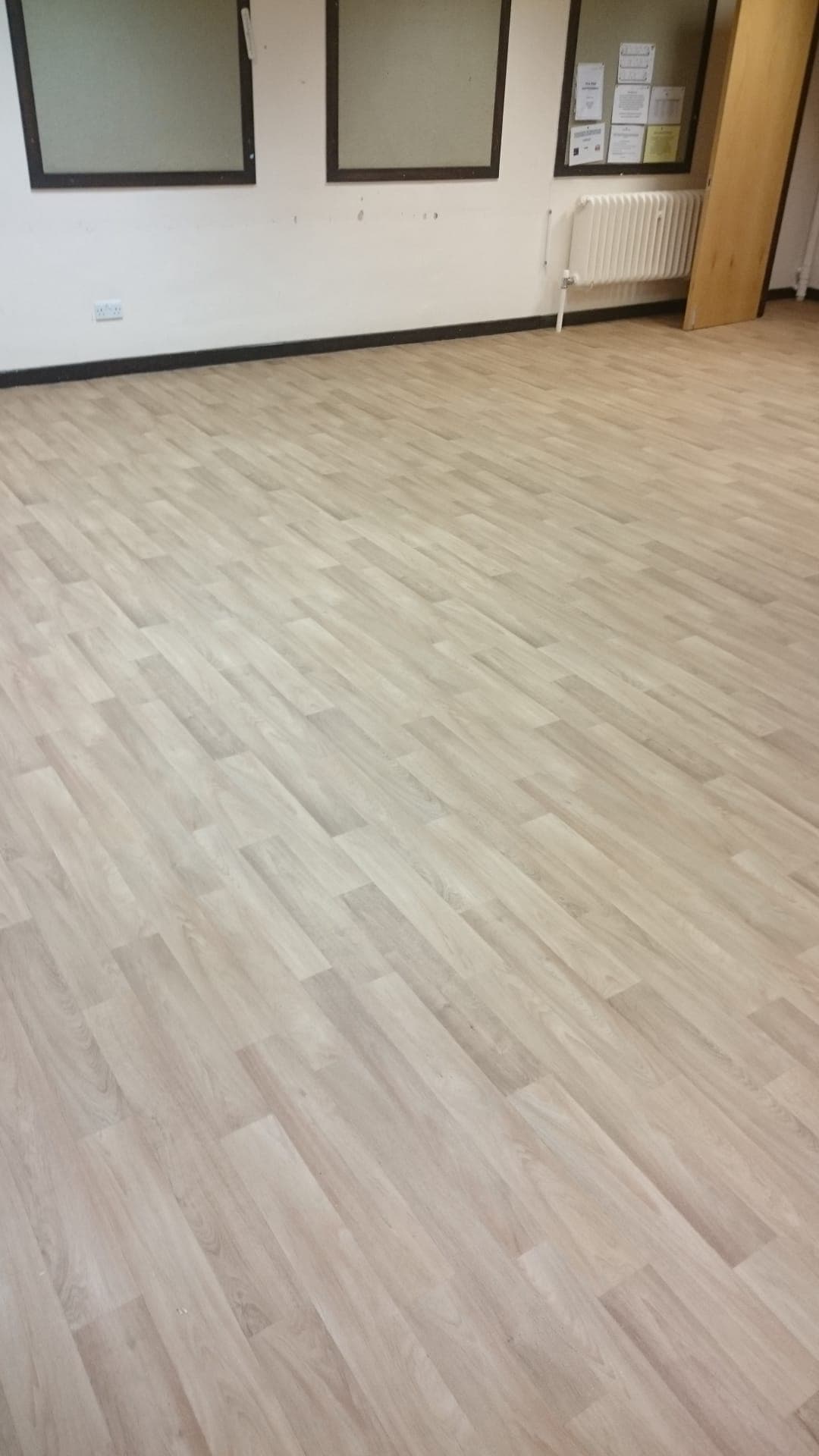 High-gloss seamless epoxy floor in an industrial setting